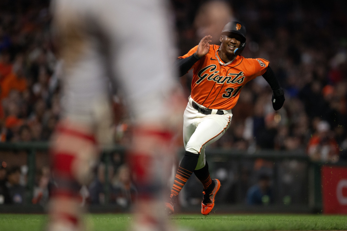 SF Giants shortstop Marco Luciano digs for home plate on an RBI single by Michael Conforto during the sixth inning against the Boston Red Sox at Oracle Park on July 28, 2023.